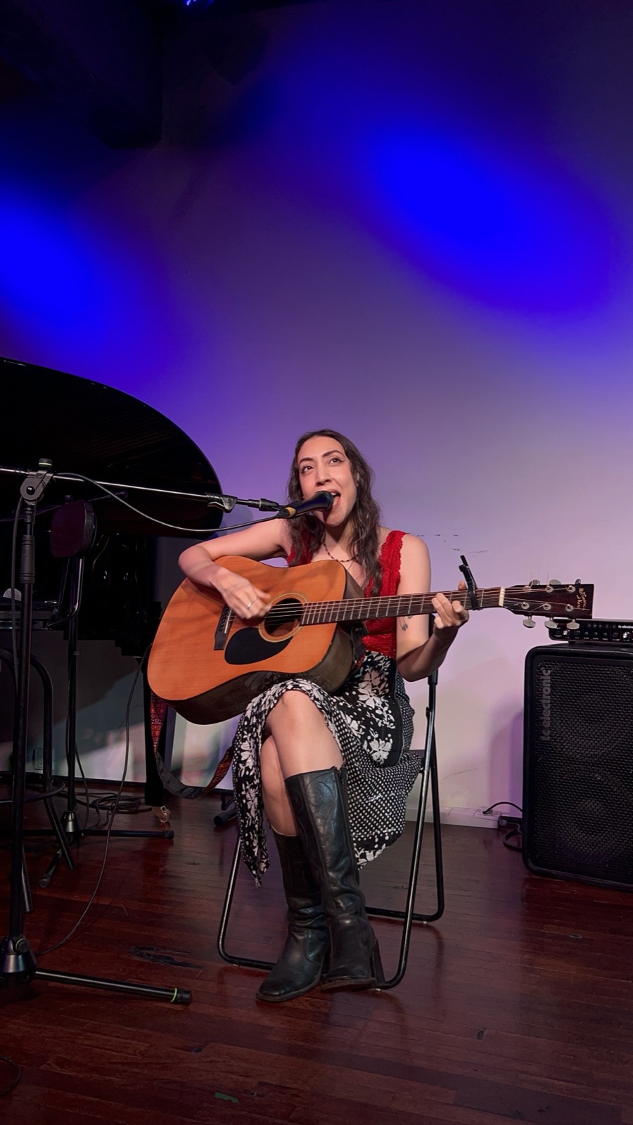 Womxn on Stage — performer singing with guitar on stage at Bobo KL, Kuala Lumpur